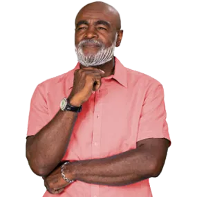 African American man with light red shirt standing and thinking with a smile on his face